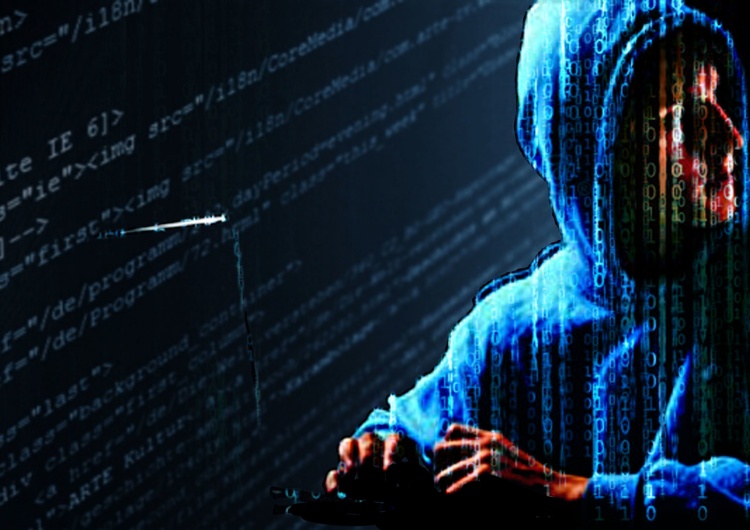 Haker - zdjęcie ilustracyjne Cyberatak na Ukrainie. Ofiarą padły banki i strony rządowe
